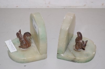 Lot 108 - Pair of onyx bookends with metal models of...