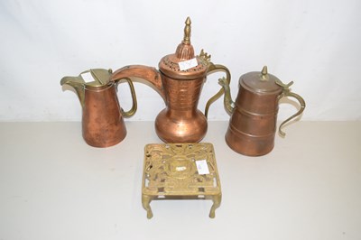 Lot 168 - Copper wares, jars and a small trivet