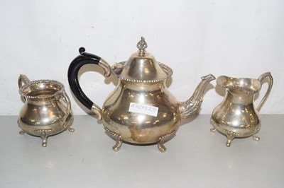 Lot 214 - A plated teapot, milk jug and sugar bowl