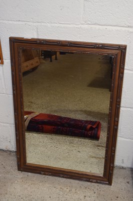Lot 246 - A modern wall mirror in dark wood bamboo...