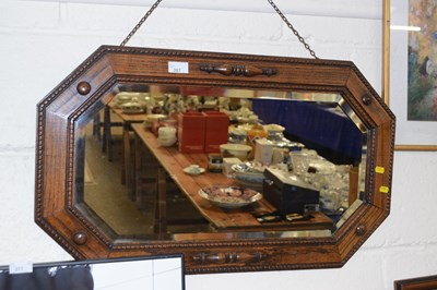 Lot 267 - A 1930's oak framed octagonal wall mirror