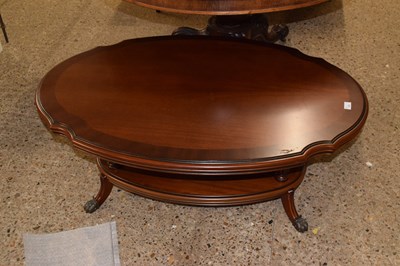 Lot 308 - A reproduction mahogany finish oval coffee table