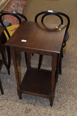 Lot 315 - A two tier lamp table