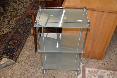 Lot 335 - A three tier metal and frosted glass shelf unit