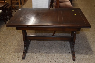 Lot 345 - A dark Ercol drawer leaf dining table