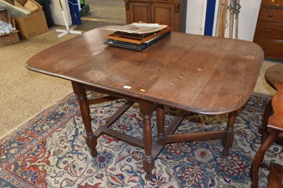 Lot 350 - An oak drop leaf dining table