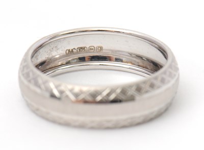 Lot 92 - A 9ct white gold ring, 8mm wide, hallmarked...