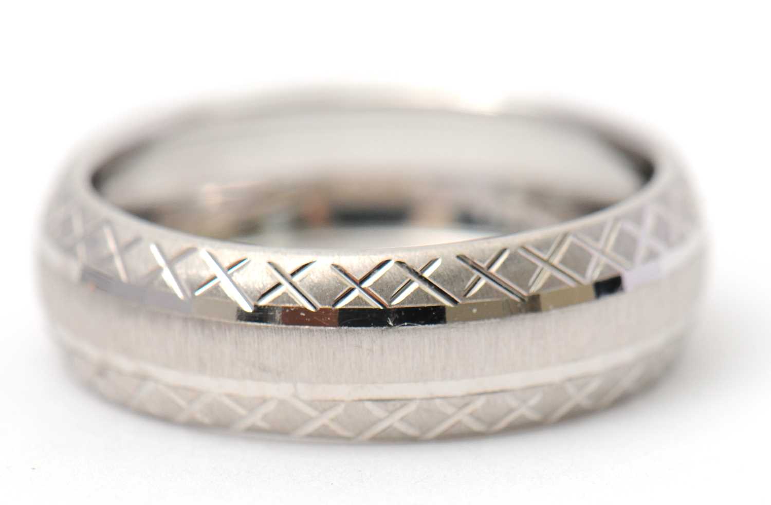 Lot 92 - A 9ct white gold ring, 8mm wide, hallmarked...