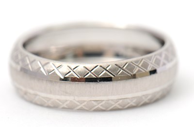 Lot 92 - A 9ct white gold ring, 8mm wide, hallmarked...