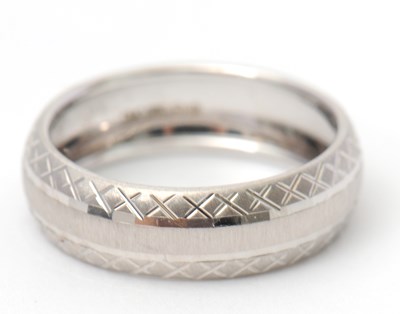 Lot 92 - A 9ct white gold ring, 8mm wide, hallmarked...
