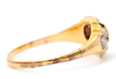 Lot 8 - A garnet and seed pearl ring, the central...