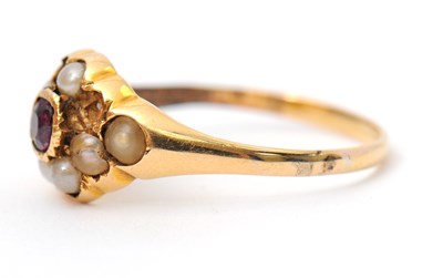 Lot 8 - A garnet and seed pearl ring, the central...
