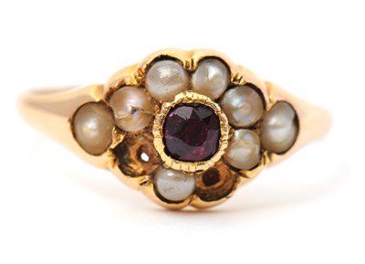 Lot 8 - A garnet and seed pearl ring, the central...