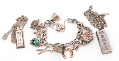 Lot 140 - Two silver ingot necklaces, both with silver...