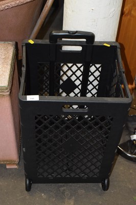 Lot 796 - A folding wheeled basket