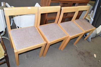 Lot 814 - A set of four light wood dining chairs