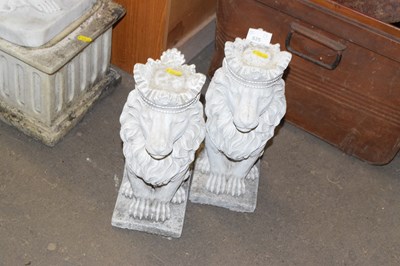 Lot 825 - A pair of reconstituted stone lions