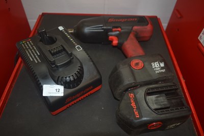 Lot 12 - A Snap-on 1/2" cordless impact gun with two...