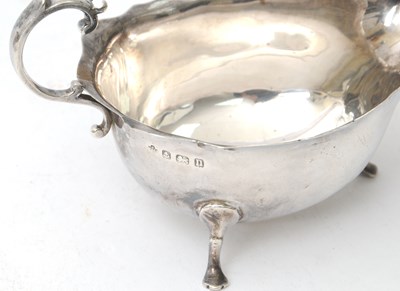 Lot 71 - A George V silver sauce boat of typical form...
