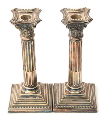 Lot 1 - A pair of Elizabeth II silver candlesticks...