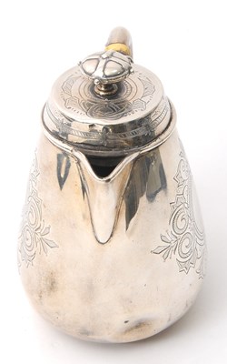 Lot 8 - A Victorian silver hot water jug of slight...