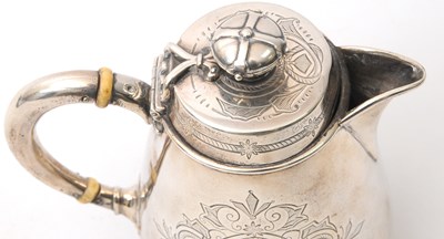 Lot 8 - A Victorian silver hot water jug of slight...