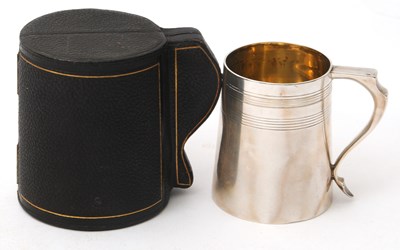 Lot 9 - A late 19th Century silver christening tankard...