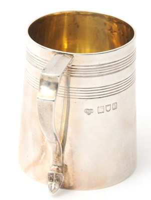 Lot 9 - A late 19th Century silver christening tankard...