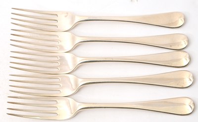 Lot 18 - A group of five George III silver table forks,...