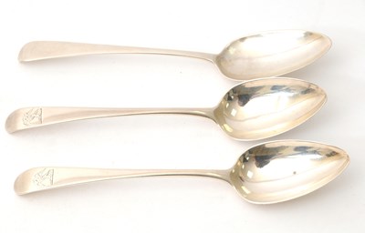 Lot 22 - Three George III silver dessert spoons with...