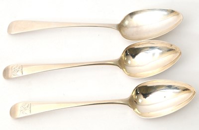 Lot 22 - Three George III silver dessert spoons with...