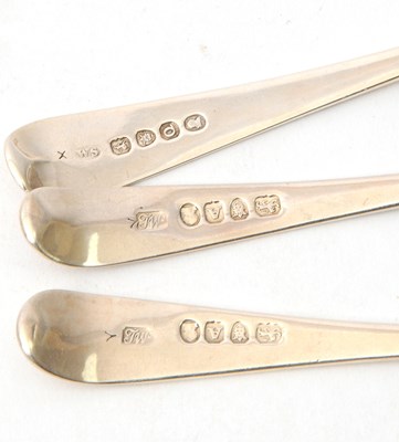 Lot 22 - Three George III silver dessert spoons with...
