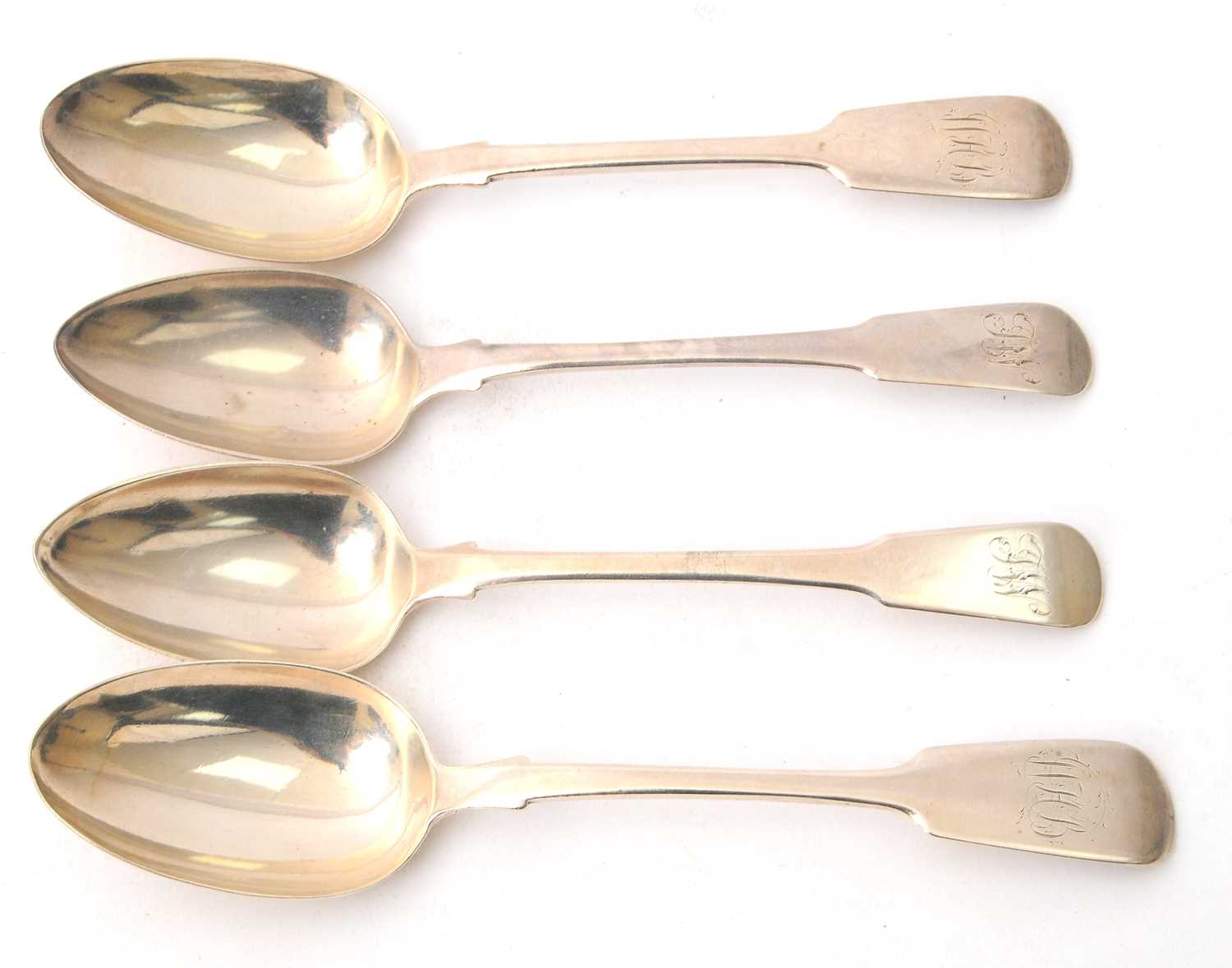 Lot 36 - A group of four silver fiddle pattern serving...