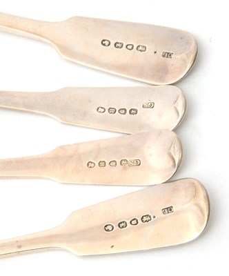 Lot 36 - A group of four silver fiddle pattern serving...
