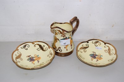 Lot 47 - A Wade lustre finish jug and two saucers