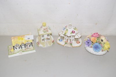 Lot 50 - A group of three Coalport porcelain cottages...
