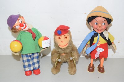 Lot 77 - A wind up toy Pinnochio together with a...
