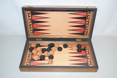 Lot 165 - A folding travelling games table