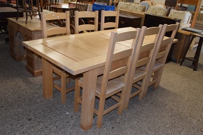 Lot 251 - Modern light oak extending dining table and...