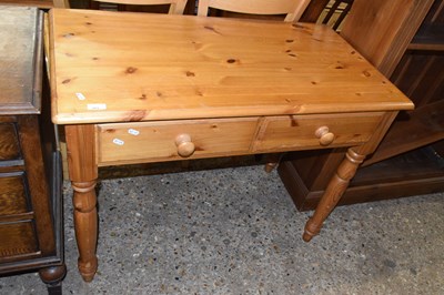 Lot 303 - A pine two drawer side table