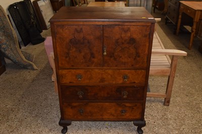 Lot 306 - A 1930's walnut veneered tall boy cabinet with...