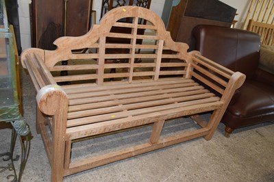 Lot 309 - A reproduction teak garden bench