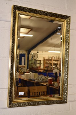 Lot 228 - A modern wall mirror in gilt finish frame