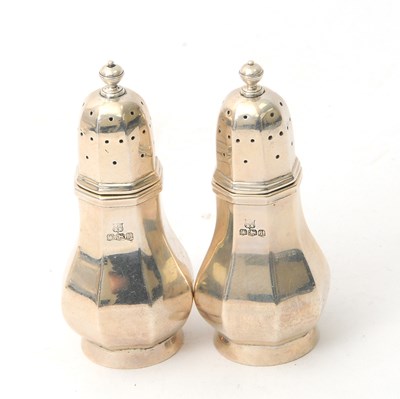 Lot 60 - A pair of George V silver casters of octagonal...