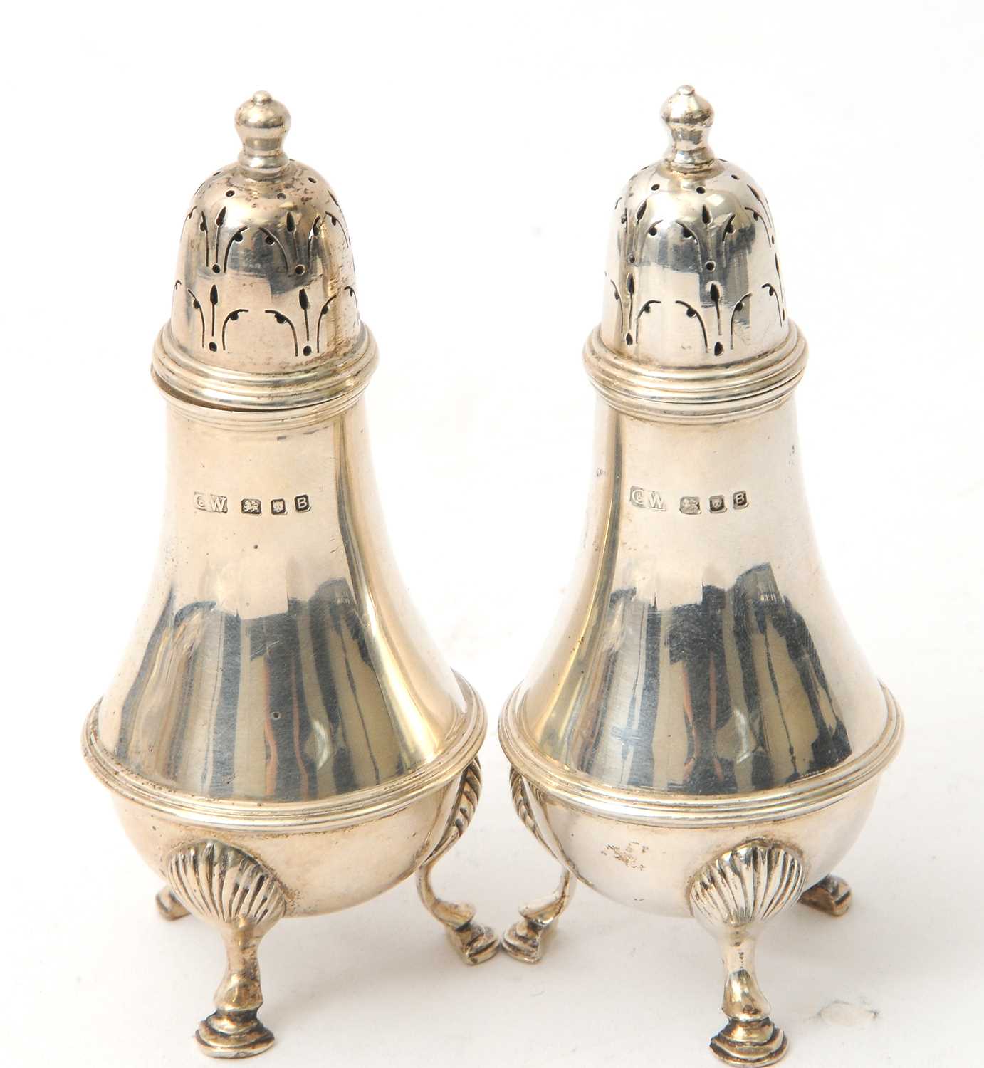 Lot 69 - A pair of George VI silver sifters of plain...