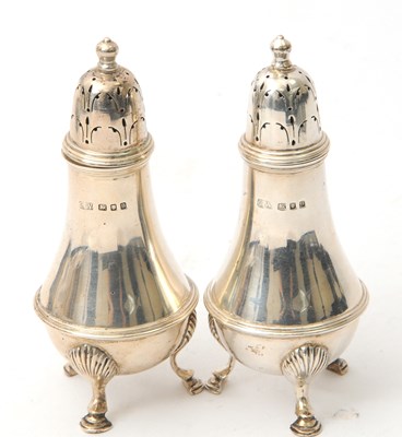Lot 69 - A pair of George VI silver sifters of plain...