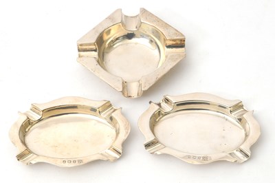 Lot 83 - A pair of George V silver ashtrays of plain...