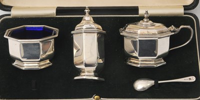 Lot 88 - A cased Art Deco three piece silver condiment...