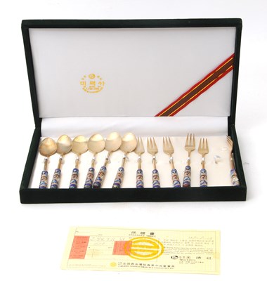 Lot 89 - A Korean twelve piece spoon/fork set, each...