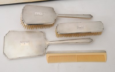 Lot 92 - A cased George VI silver mounted dressing...